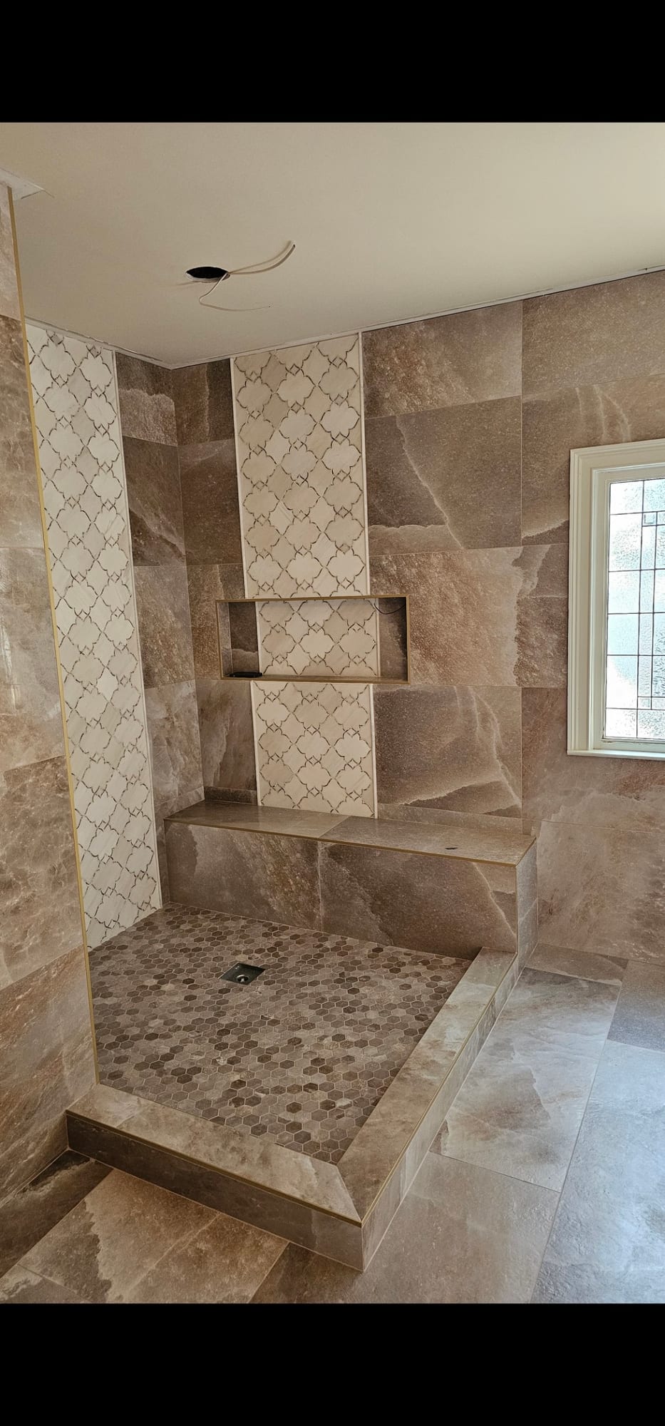 Arabesque mosaic tile shower